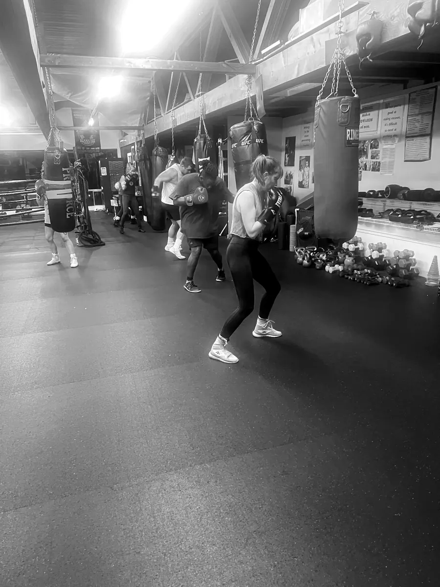 Boxer working the heavy bags at K.O. Fitness in Seattle