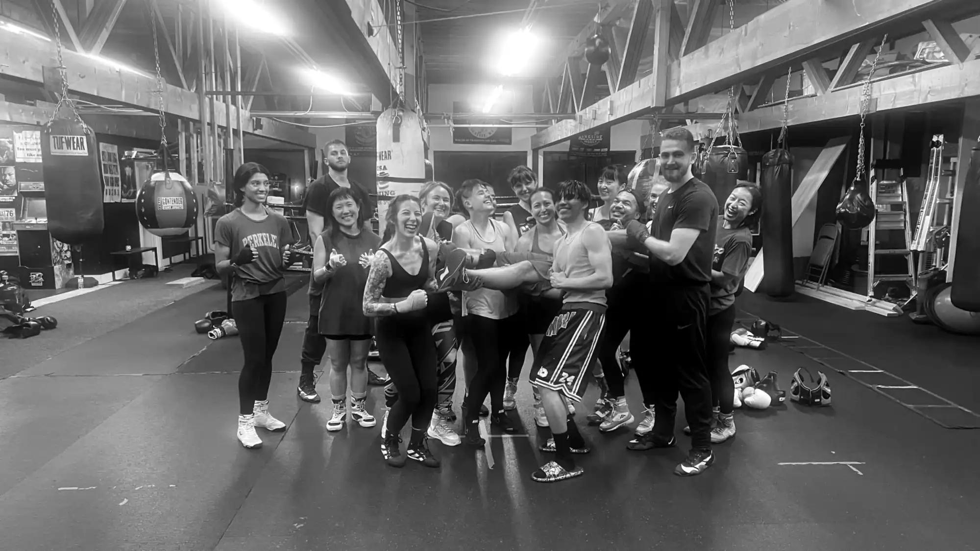 K.O. Fitness members celebrating together at the Ballard boxing gym in Seattle